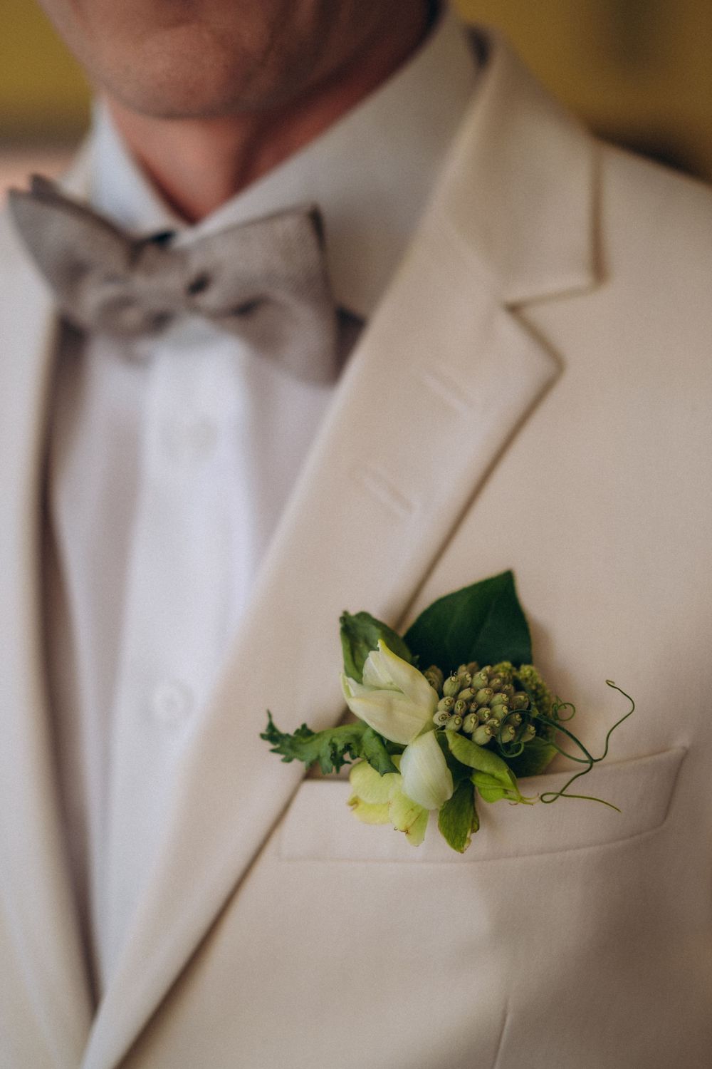 groom portrait with boutonniere stylish wedding suit detail Espoon Kartano reception photography