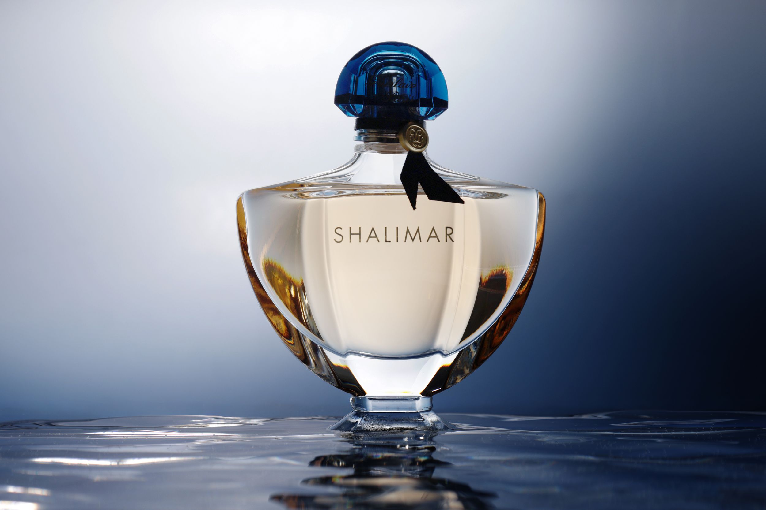 Studio product photography highlighting a luxury fragrance bottle and packaging.