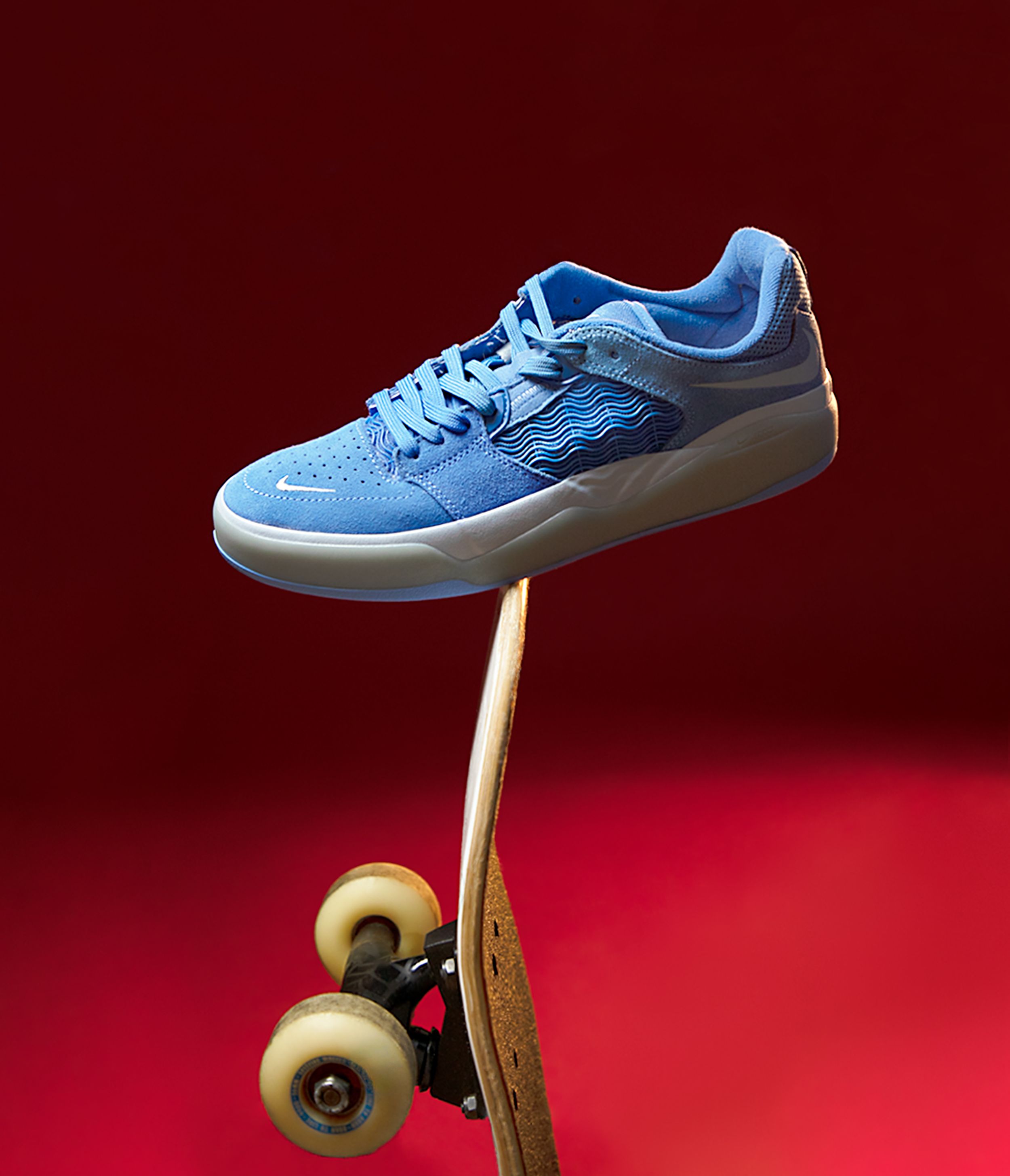 Product photography featuring a blue Nike shoe created by commercial photographer Chris Z of Zeng Studio