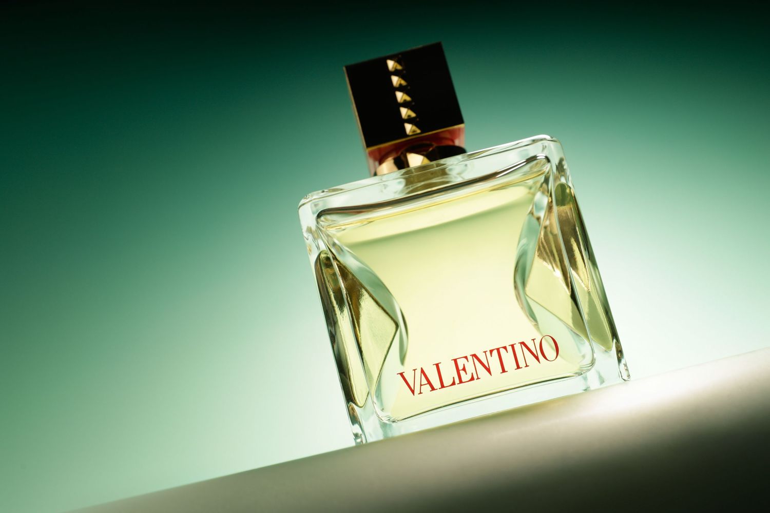 Studio product photography highlighting a luxury fragrance bottle and packaging.