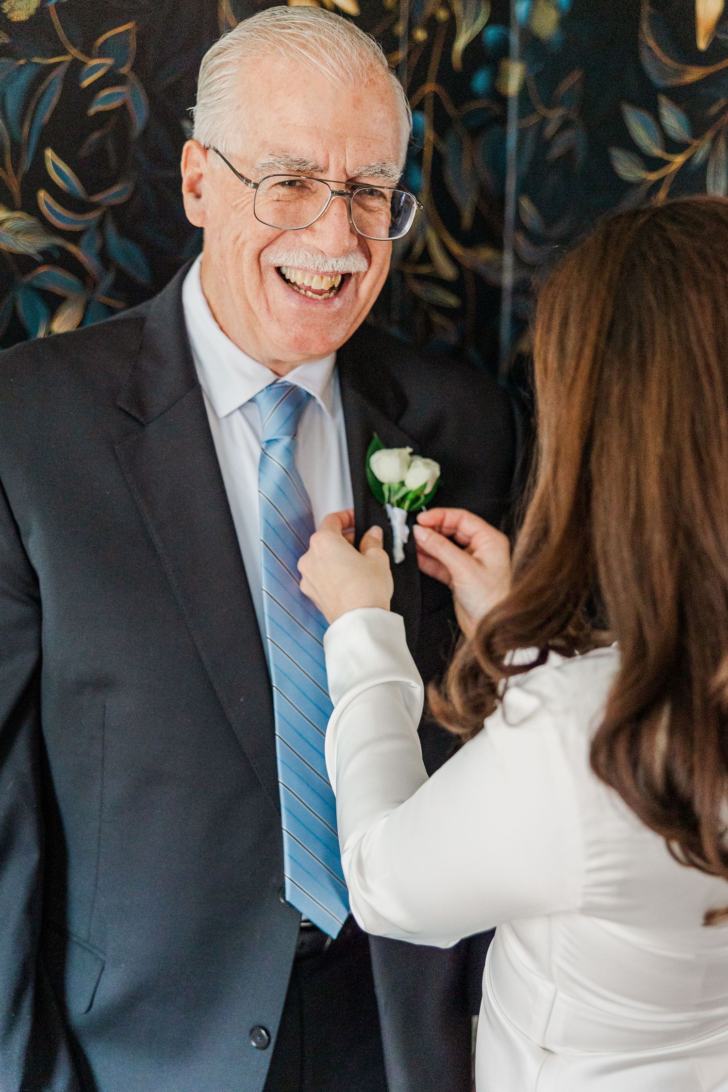 A heartwarming sequence of candid moments during a wedding dance shows a couple in formal attire sharing joyful laughter.