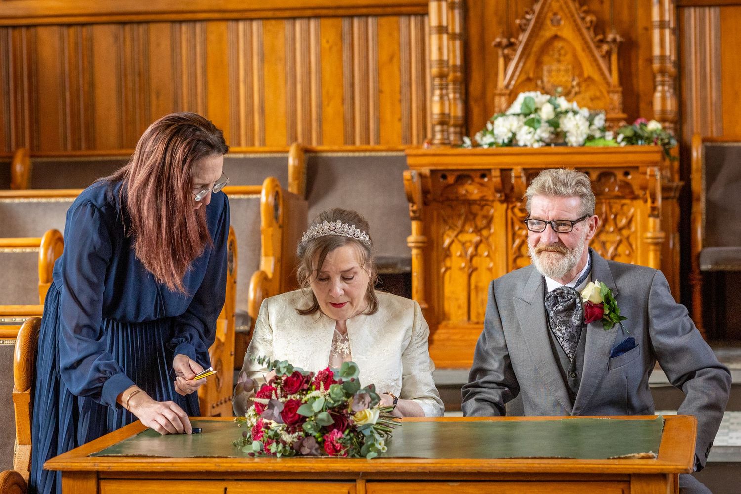 Closer shot – bride signing
Bride signing wedding register beside groom at Southport Town Hall ceremony in Merseyside