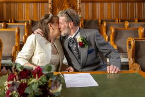 Kiss after signing
Newly married couple kissing at the register table inside Southport Town Hall wedding ceremony in Merseyside