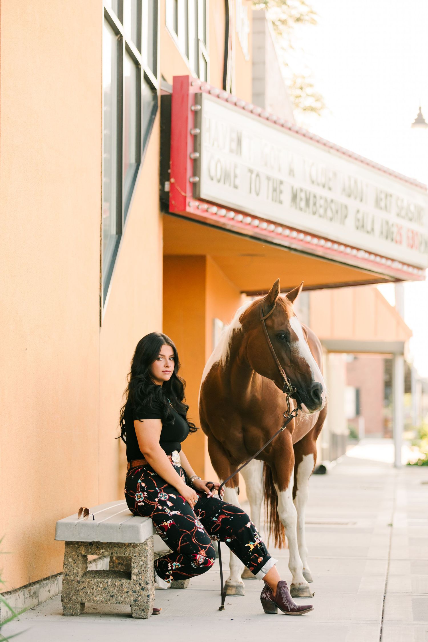 High Fashion cowgirl in downtown city with her horse captured by Northern California Horse Photographer Lauren Ann Photography
