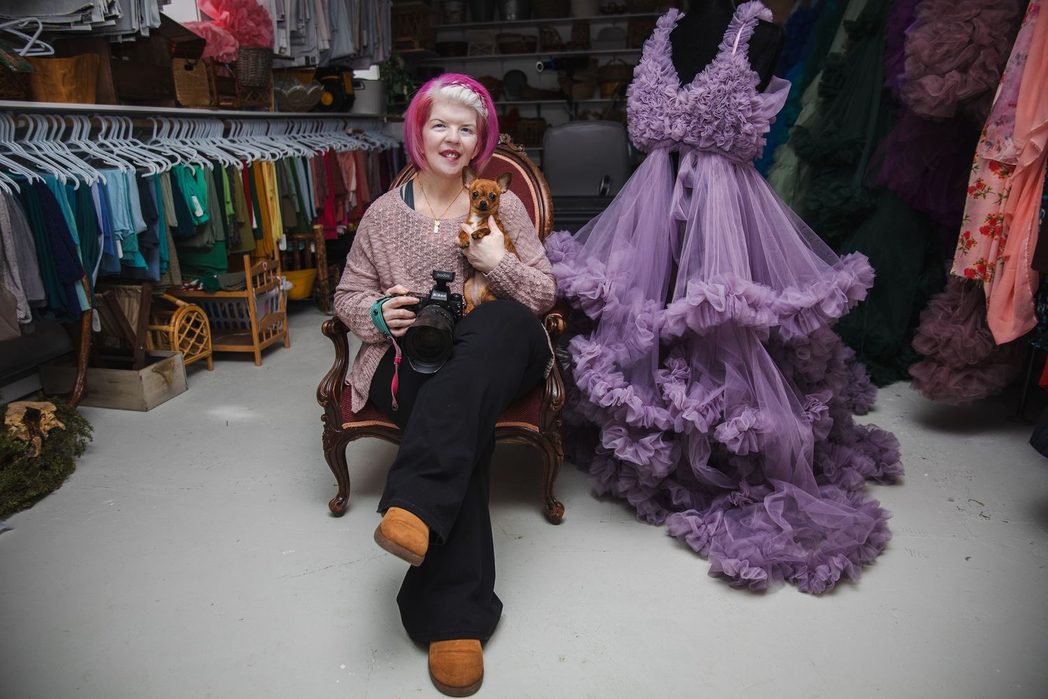 A series of photos showing someone in a black outfit posing with a flowing purple tulle dress in a studio setting.