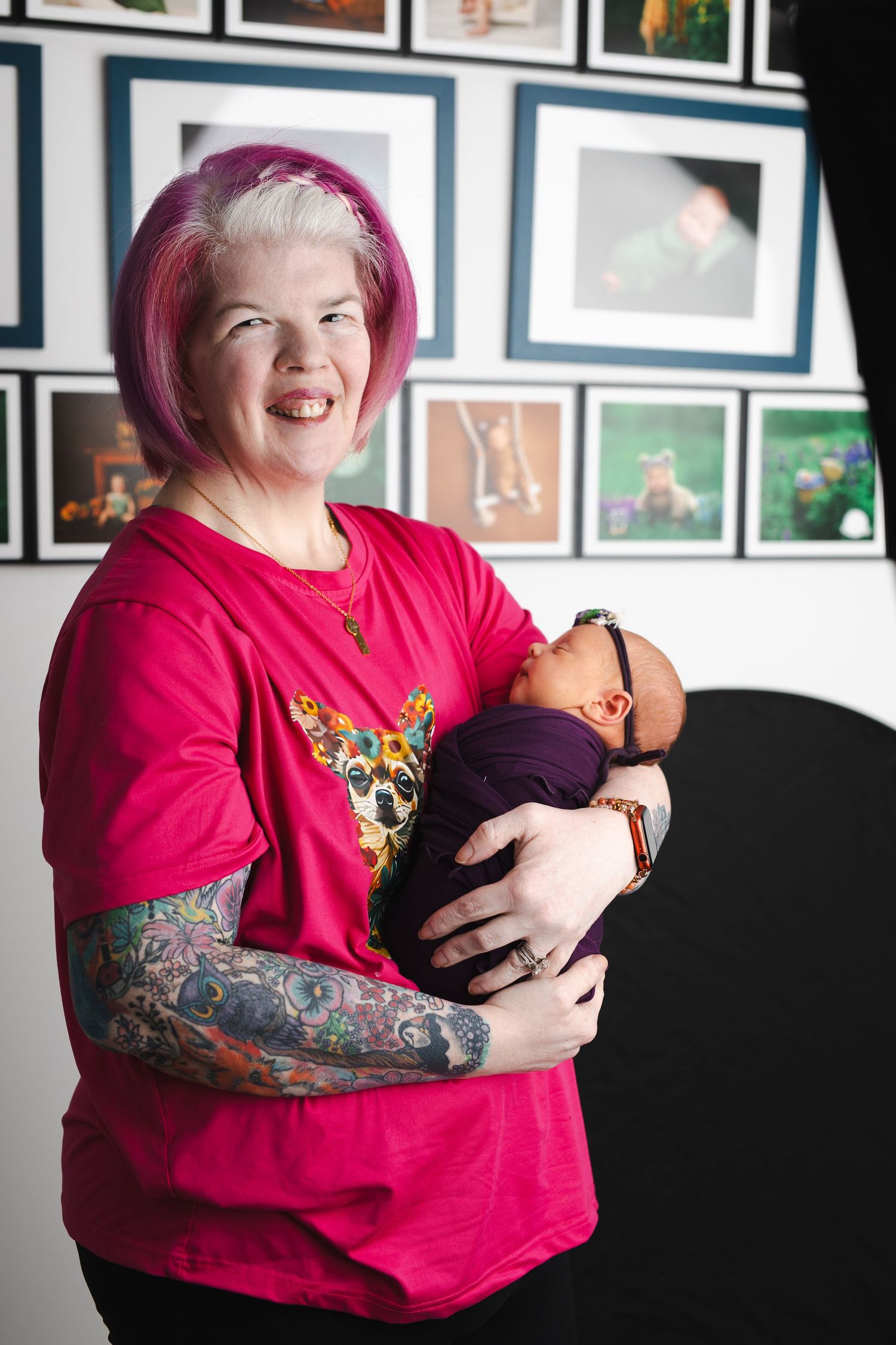 A series of four photos showing someone in a bright red shirt holding and cuddling with a small pet against a wall of framed artwork.