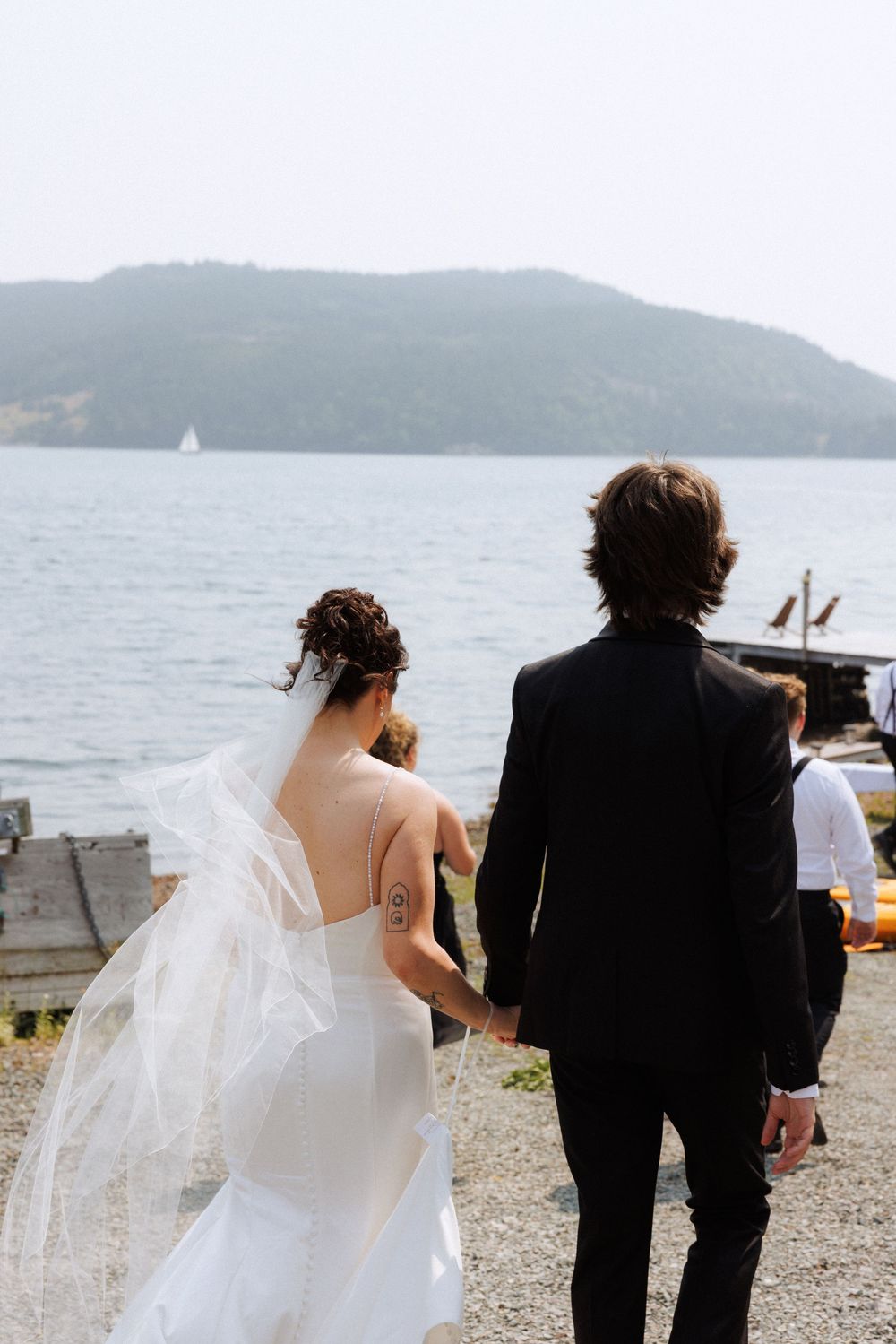 Candid bridal party photos in Trinity, Newfoundland captured by Newfoundland documentary style photographer Kaitlyn Yvette