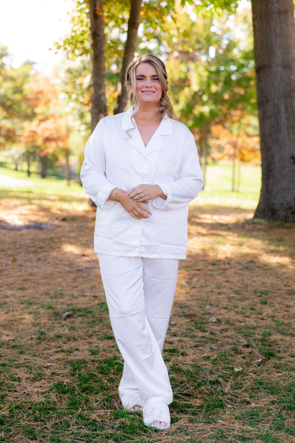 A series of outdoor portrait shots showing someone in an all-white outfit posing against a natural autumn background.