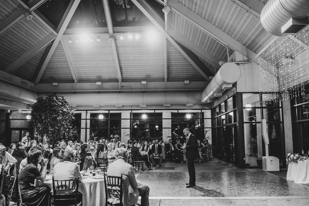 Black and white photos show a wedding reception venue with guests dancing and celebrating on a spacious dance floor.