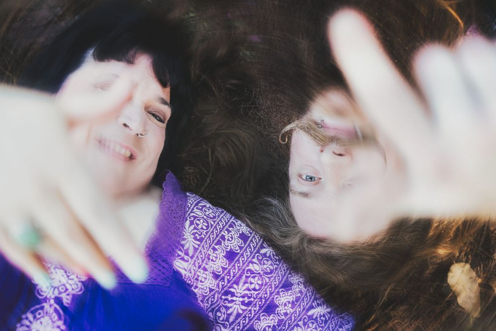 A person with dark hair wearing a purple sweater is shown in a series of candid close-up shots.