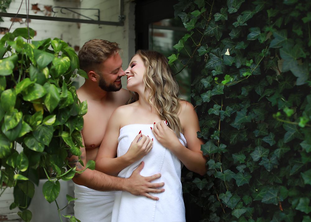 A romantic outdoor photoshoot series with couples embracing against ivy-covered walls.