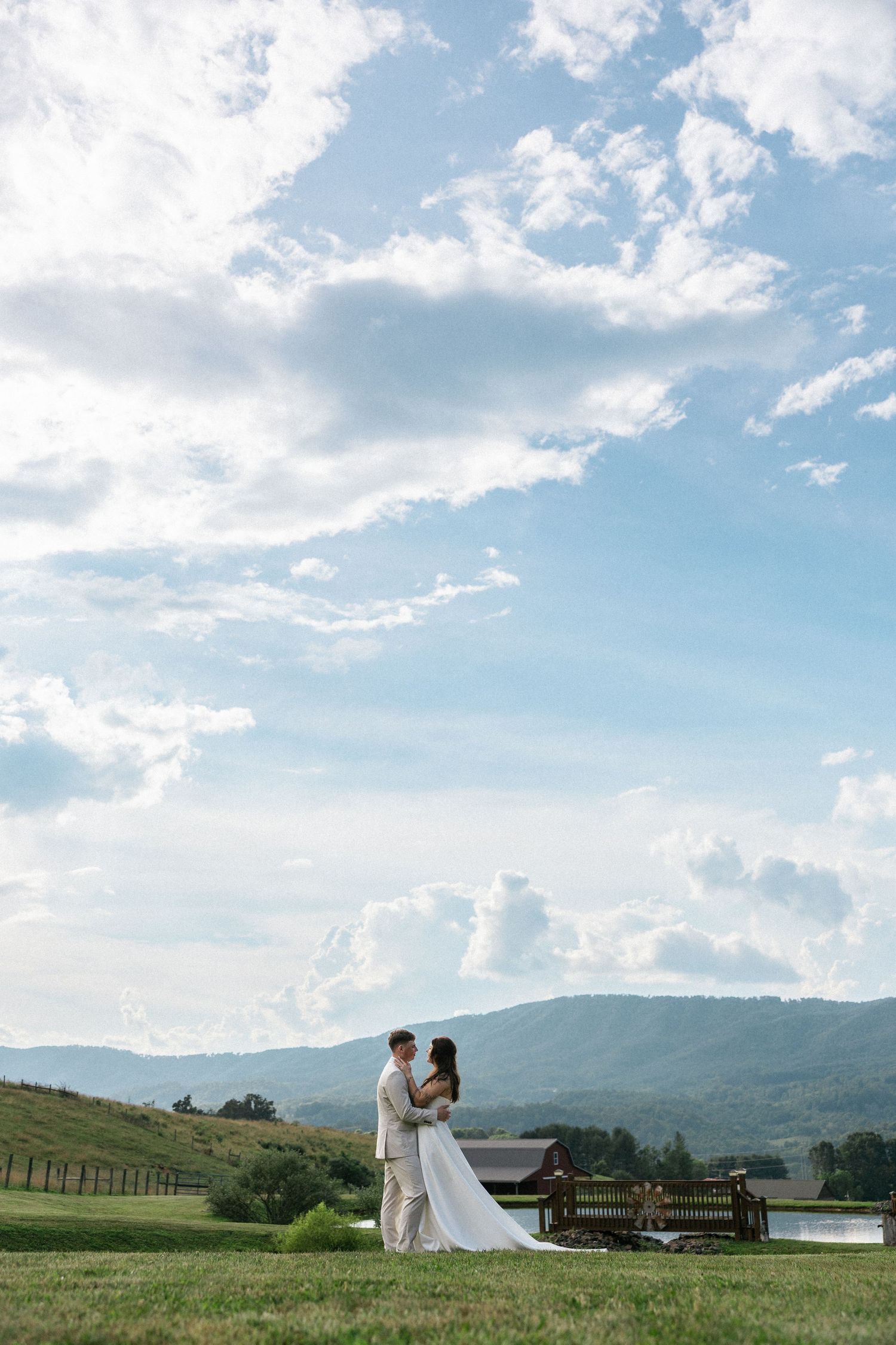 Scenic mountain landscape with rolling hills and fluffy clouds on a bright summer day.Micro wedding, elopement, intentional celebration