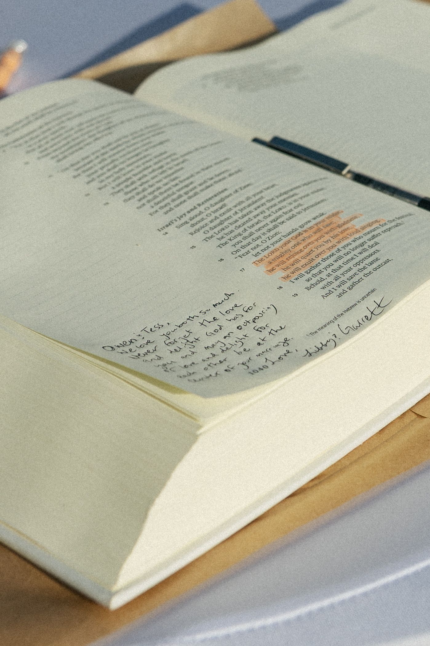 An open book with highlighted text and handwritten notes in the margins shows signs of active studying and annotation.Micro wedding, elopeme