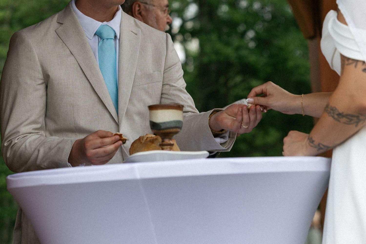 Wedding guests enjoying refreshments and appetizers during an outdoor reception.
