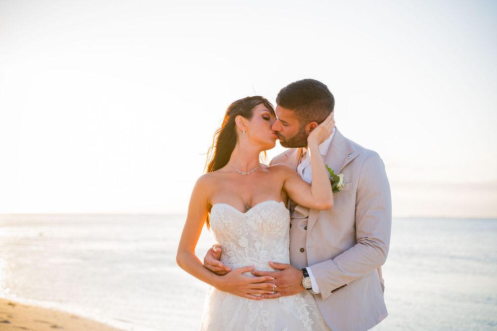 Intimate beach wedding photography sequence with soft natural lighting.