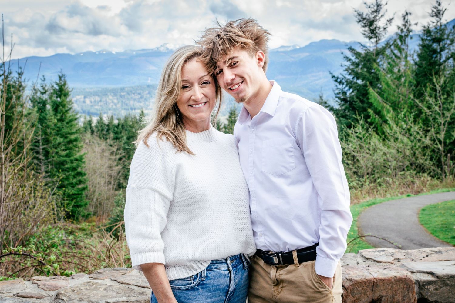 Mother and son smiling together during outdoor portraits in Seattle