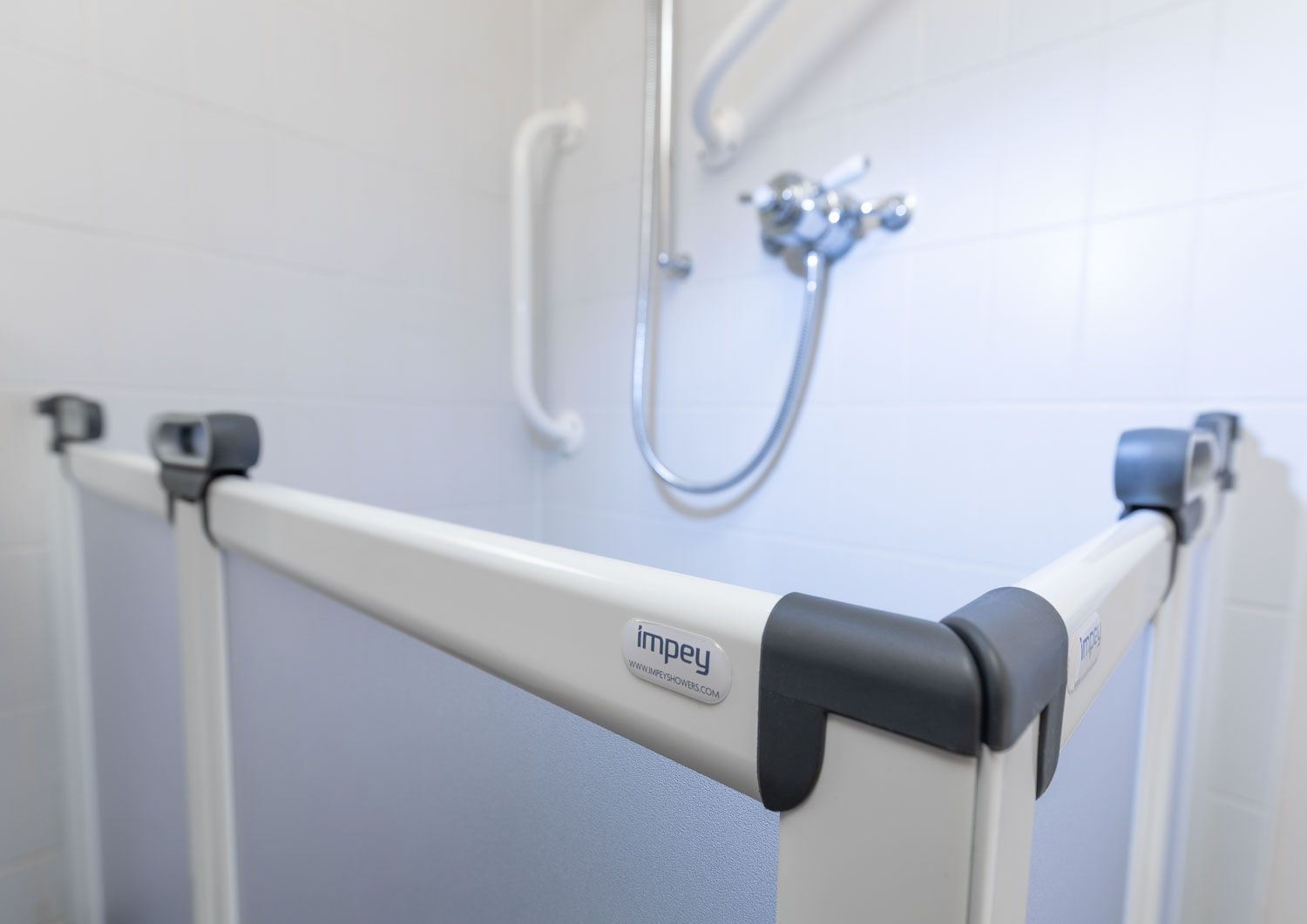 Impey shower installation photography with dramatic water lighting -1