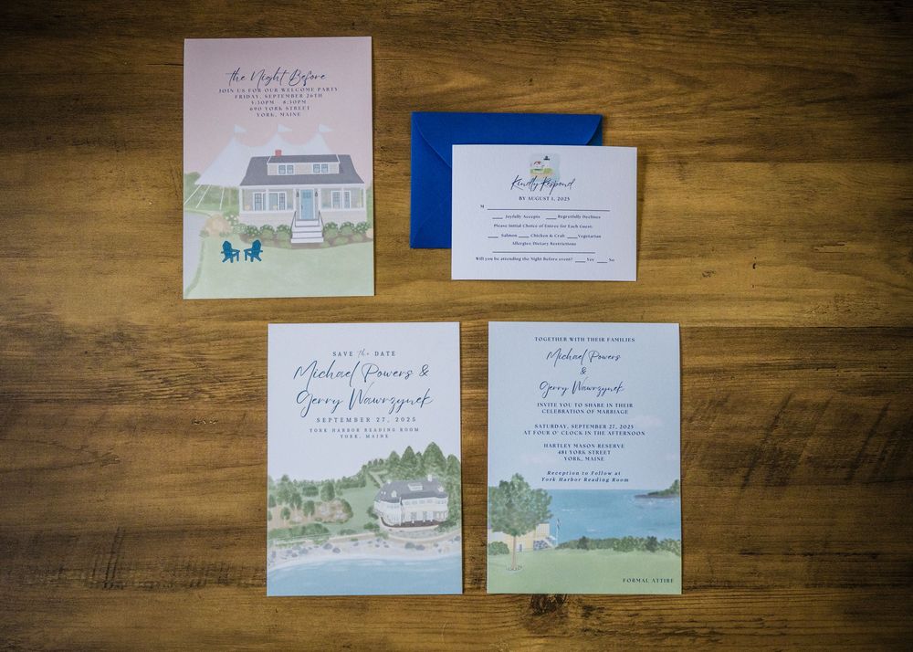 Wedding invitation suite featuring watercolor illustrations of coastal venue in blue tones.