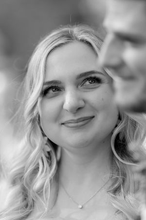Black and white portraits showing joyful expressions and genuine smiles.