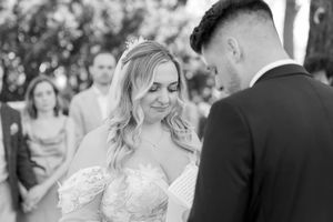 A tender moment between the bride and groom during their wedding ceremony.