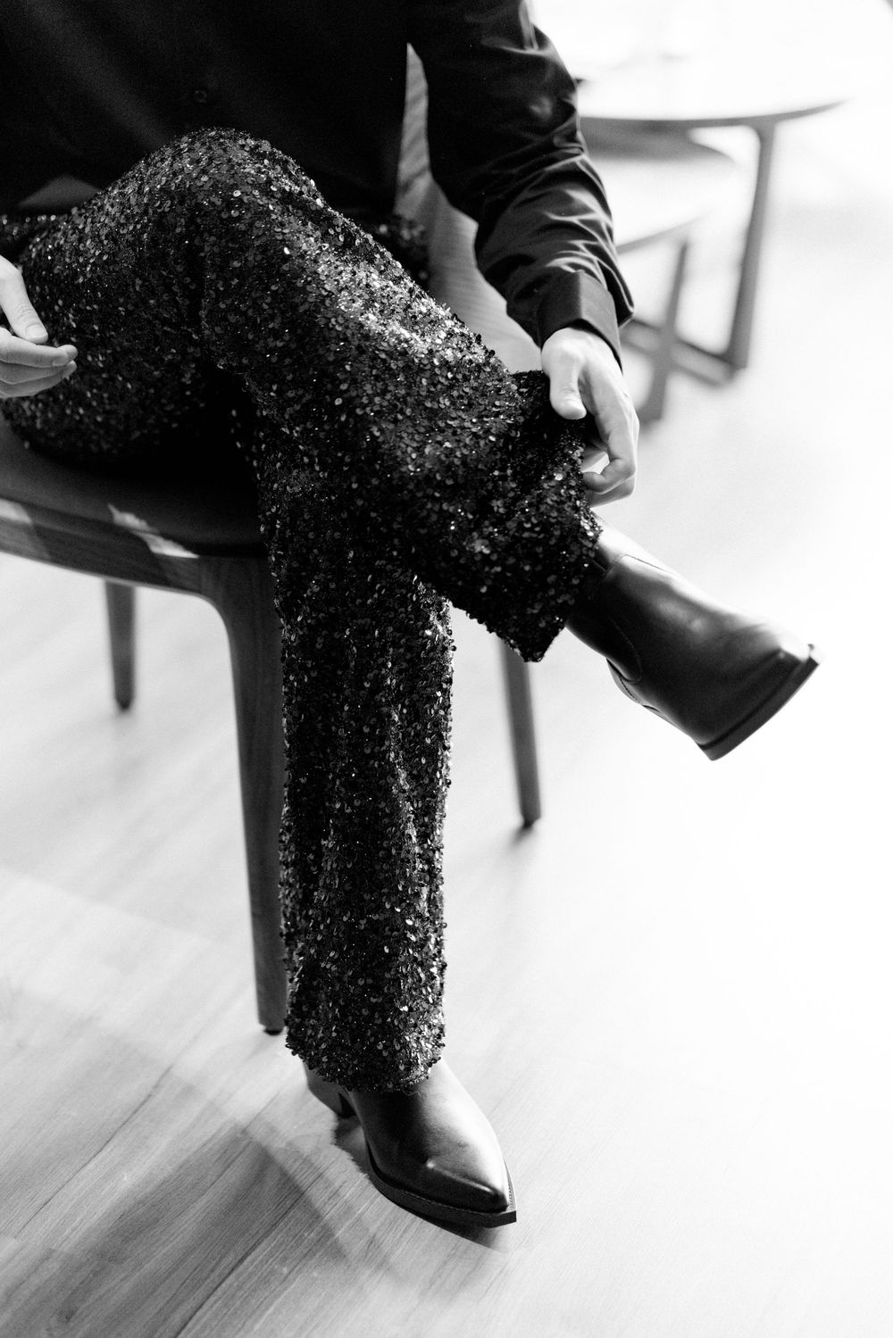 Close-up black and white shot of sparkly sequined formal attire material.