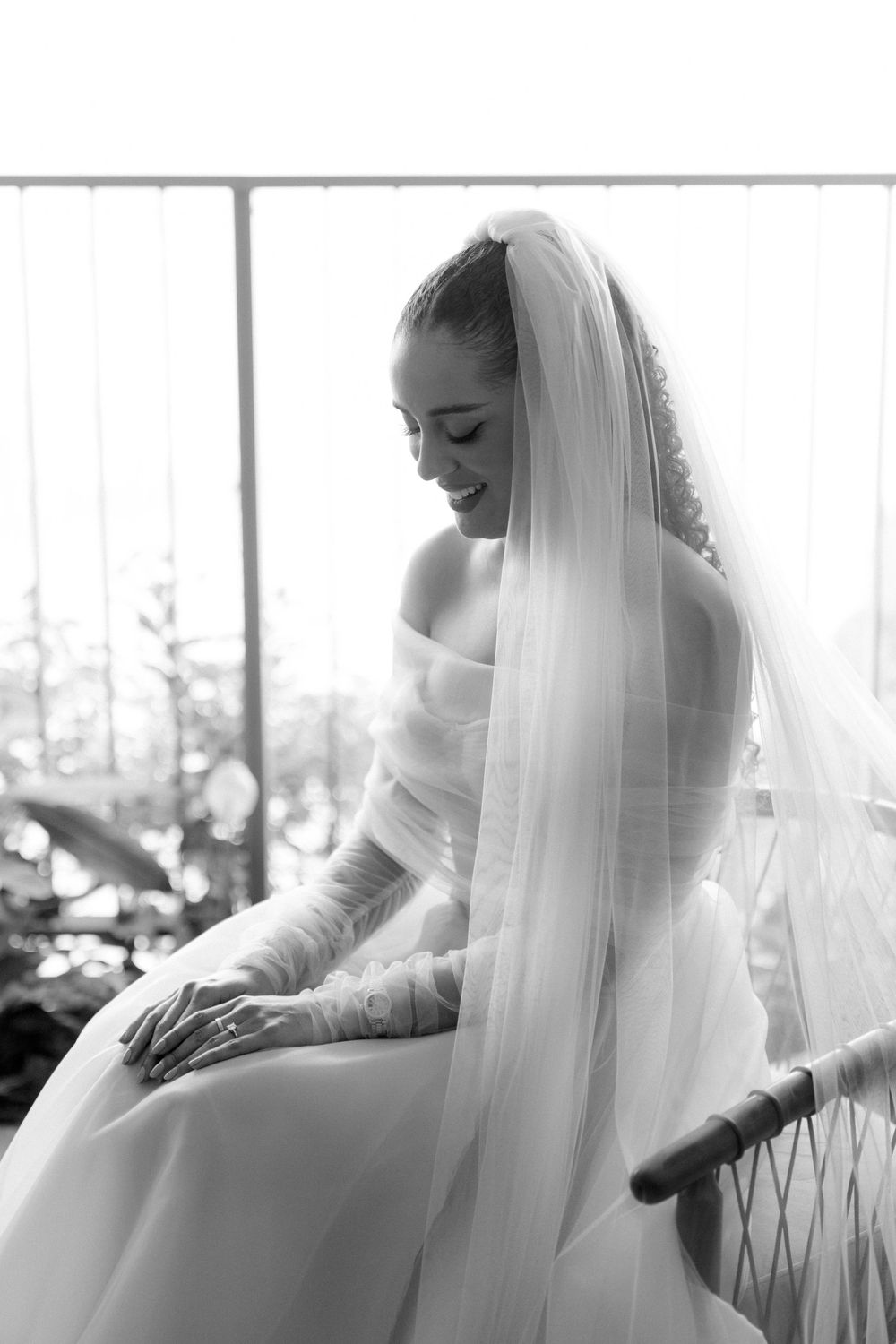 A delicate bridal portrait triptych in black and white showing a flowing veil and wedding dress.