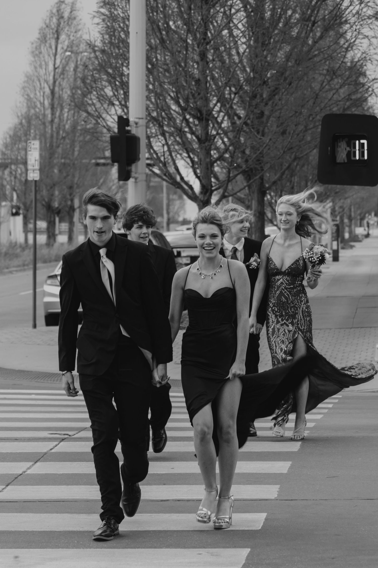 Group of Prom Attendees Walking Over Reno towards the Myriad Gardens