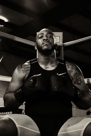 Dramatic black and white portraits of athlete in training environment.