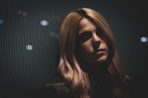 Low key portrait series showing dark silhouettes against a dramatic backlit background.