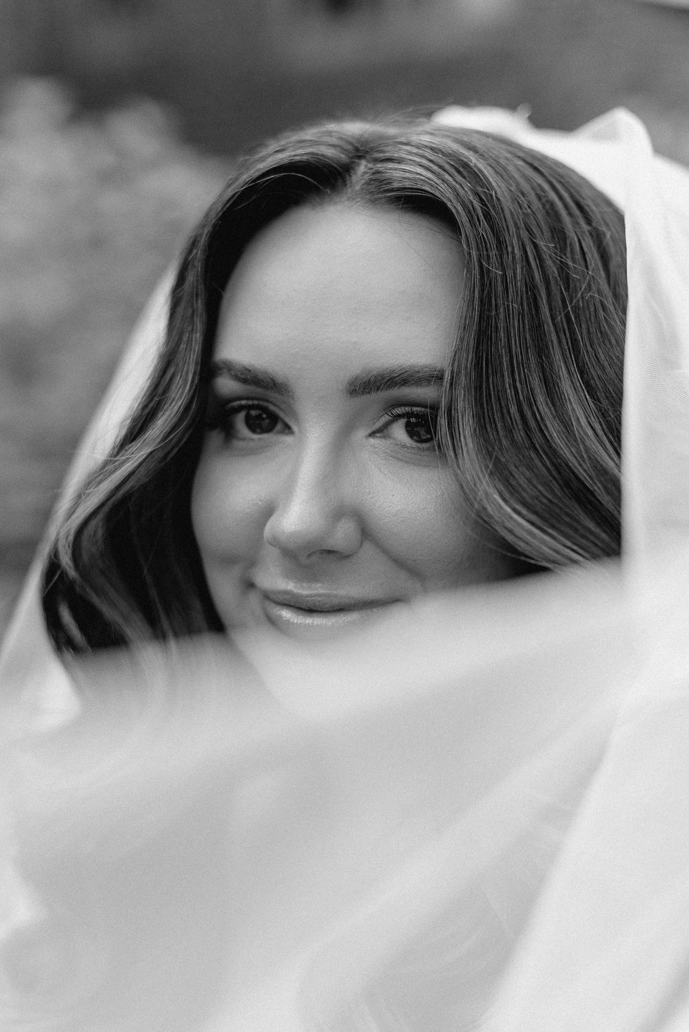 A black and white artistic portrait shot showing elegant details.