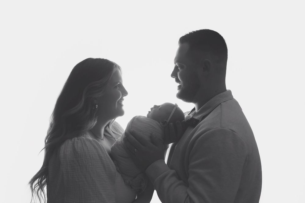 Backlit family pose, taken by Jen Knightstep, Photographer