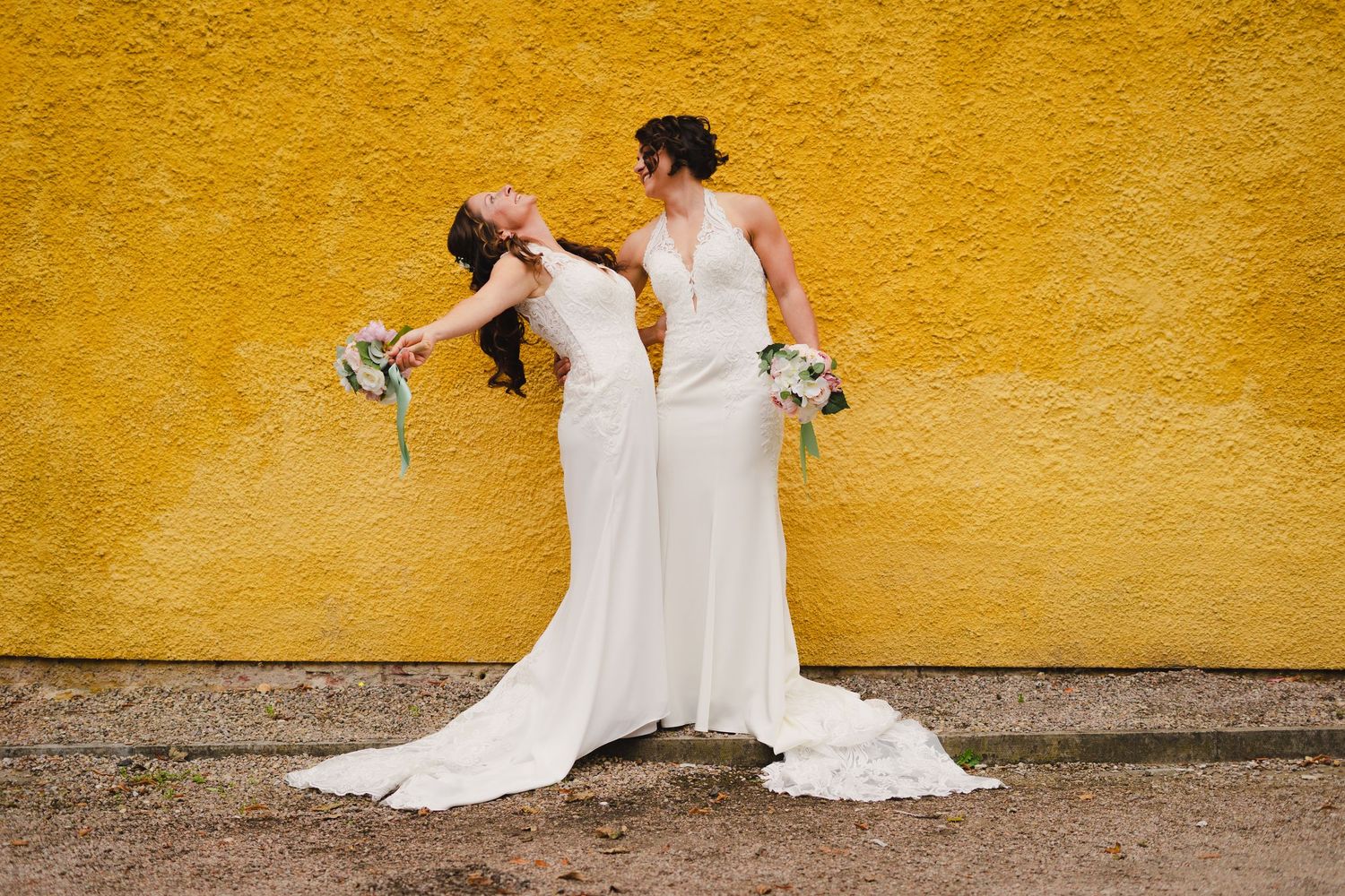 Eight elegant frames showing wedding couple in white dresses posing against vibrant yellow wall.