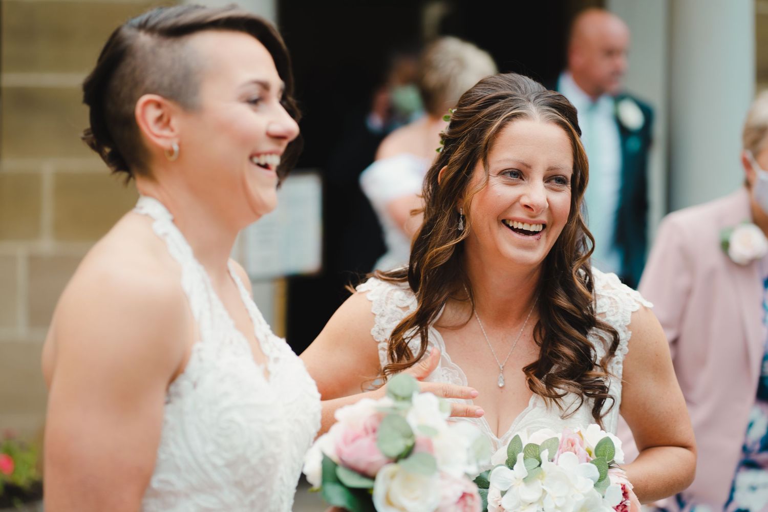 Candid moments of laughter and joy during wedding celebration.