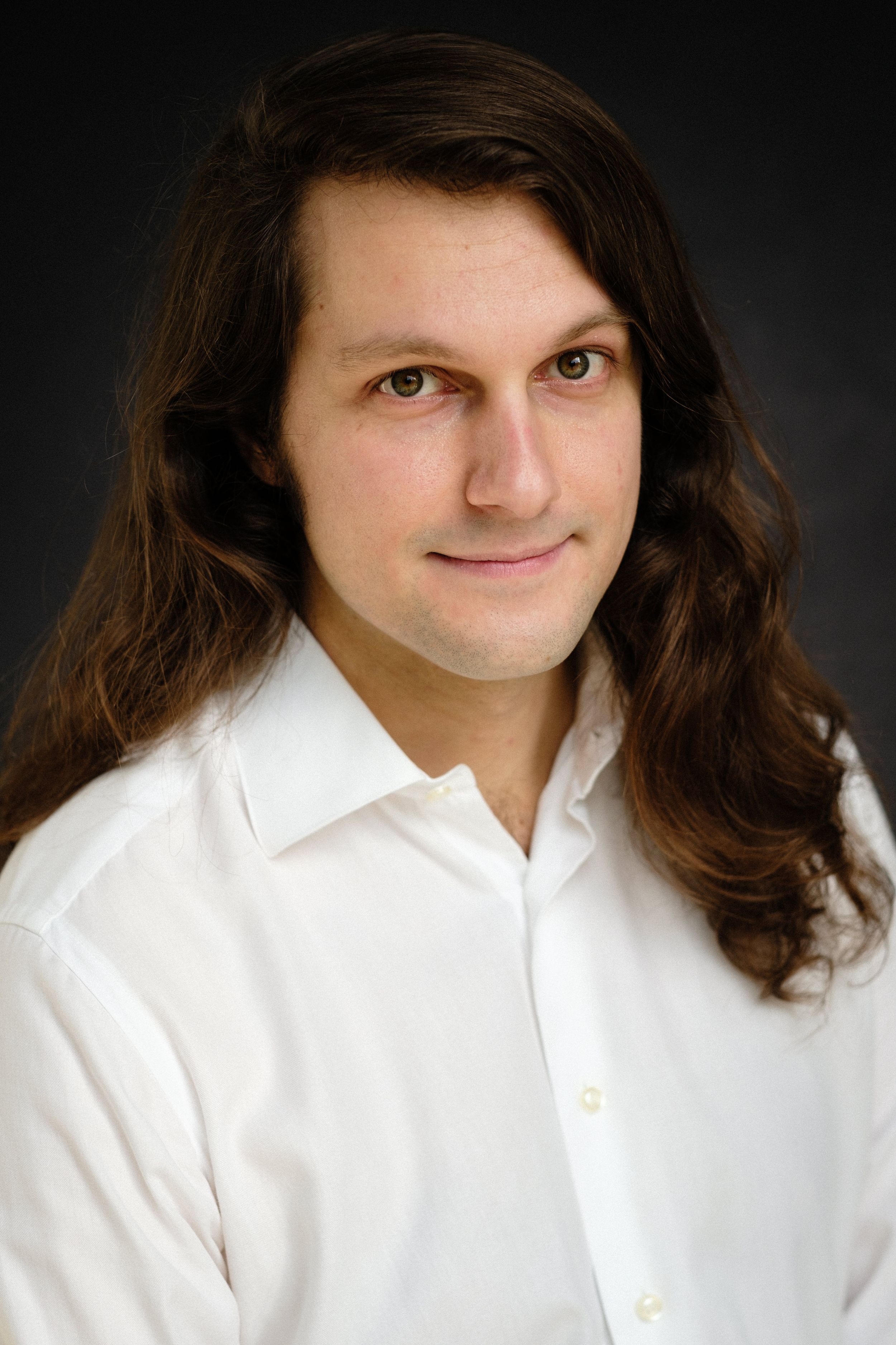 Creative portrait series with long hair and white collared shirt against dark background.