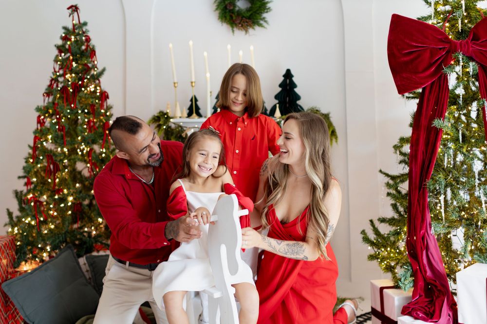 A collage of festive holiday photos showing Christmas trees, decorations, and people in red and white outfits celebrating together.