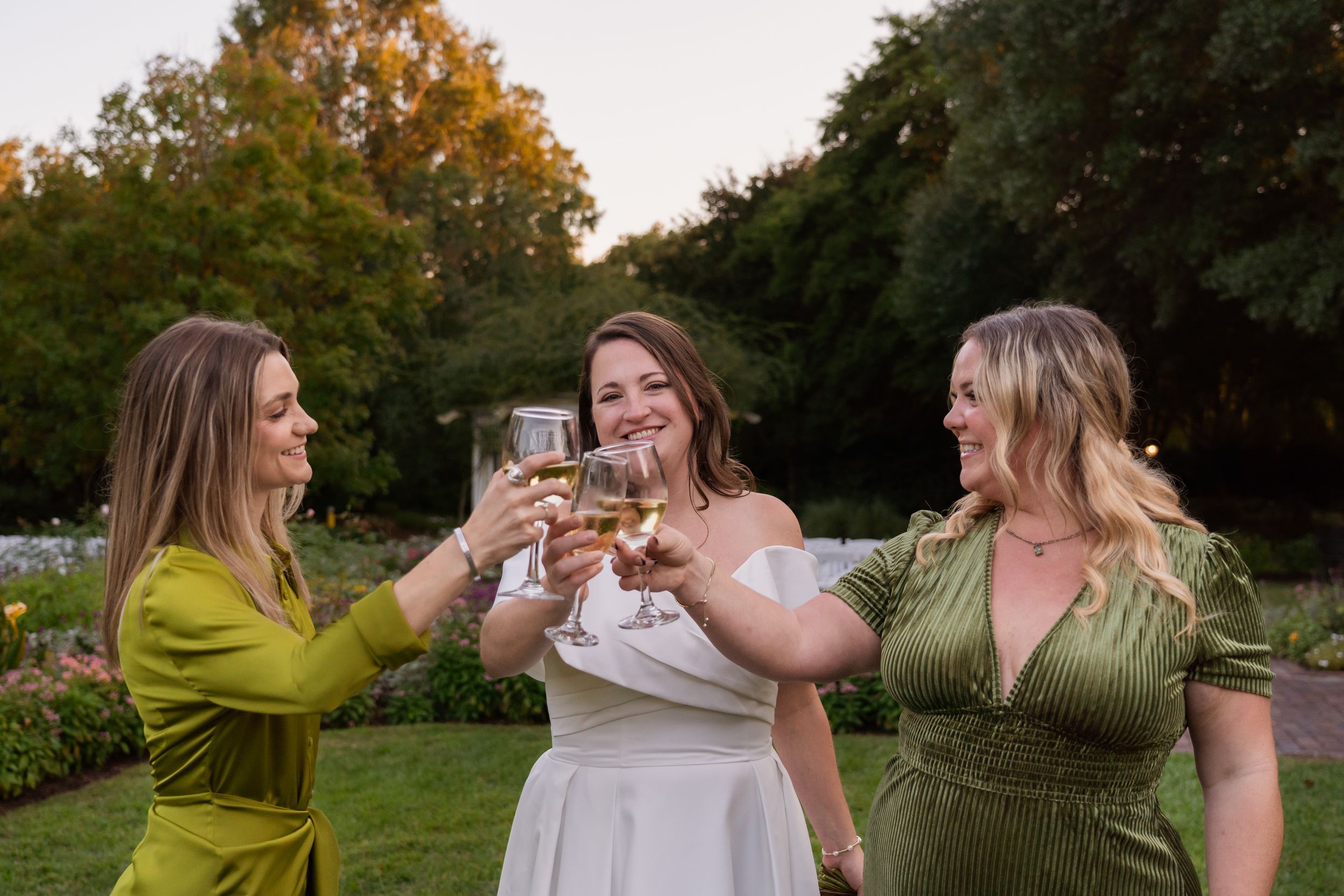 Bride making a cheers with her bridesmaids