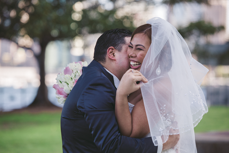 A tender moment shared during an outdoor wedding ceremony.