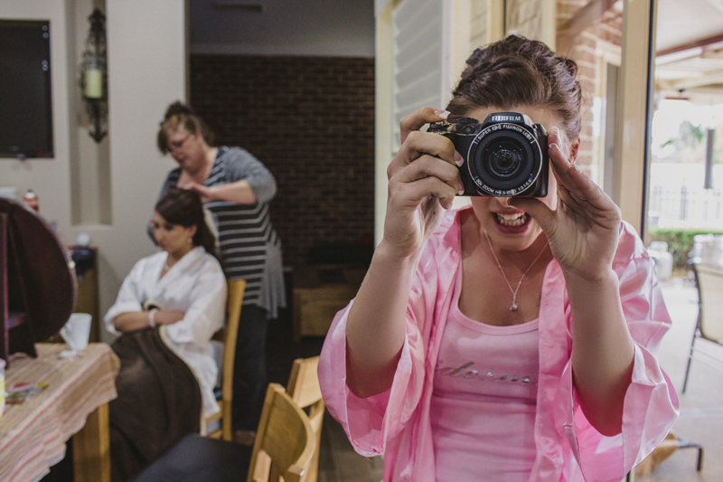 A candid moment captured with a camera in a casual indoor setting.