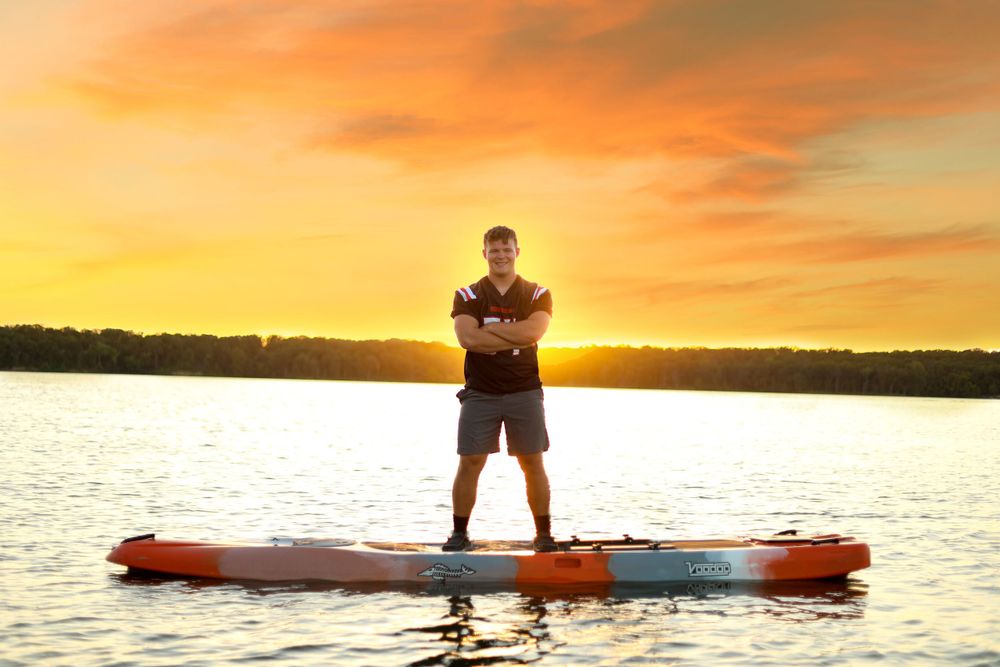 senior male portrait lake kayak football