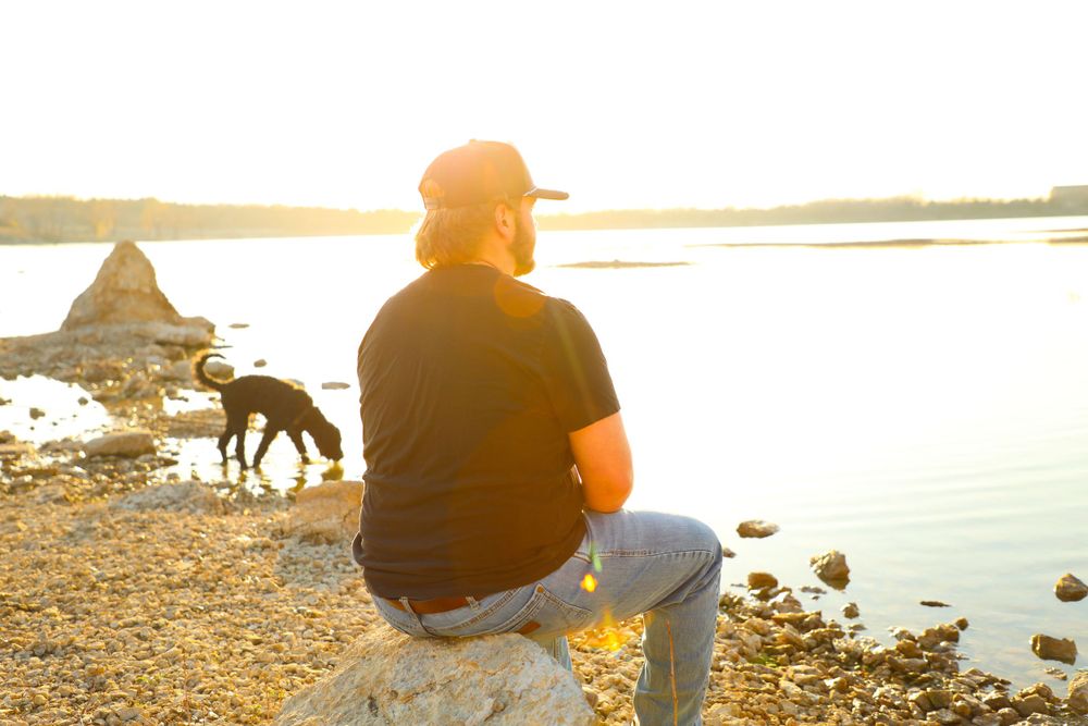 senior male portrait lake dog