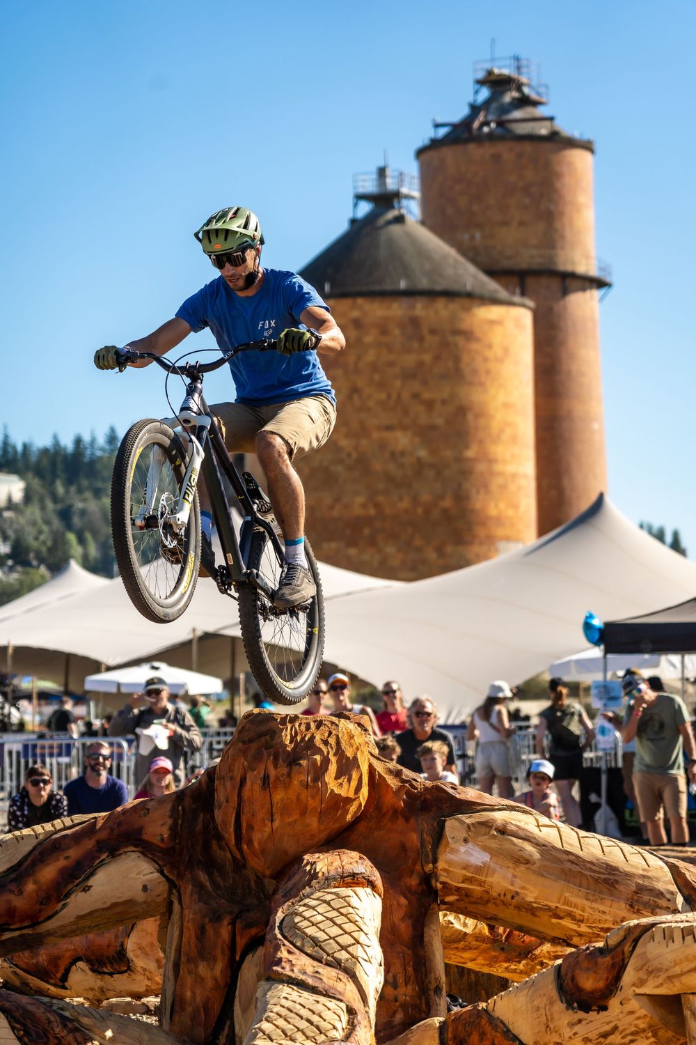 Biker balancing on back tire