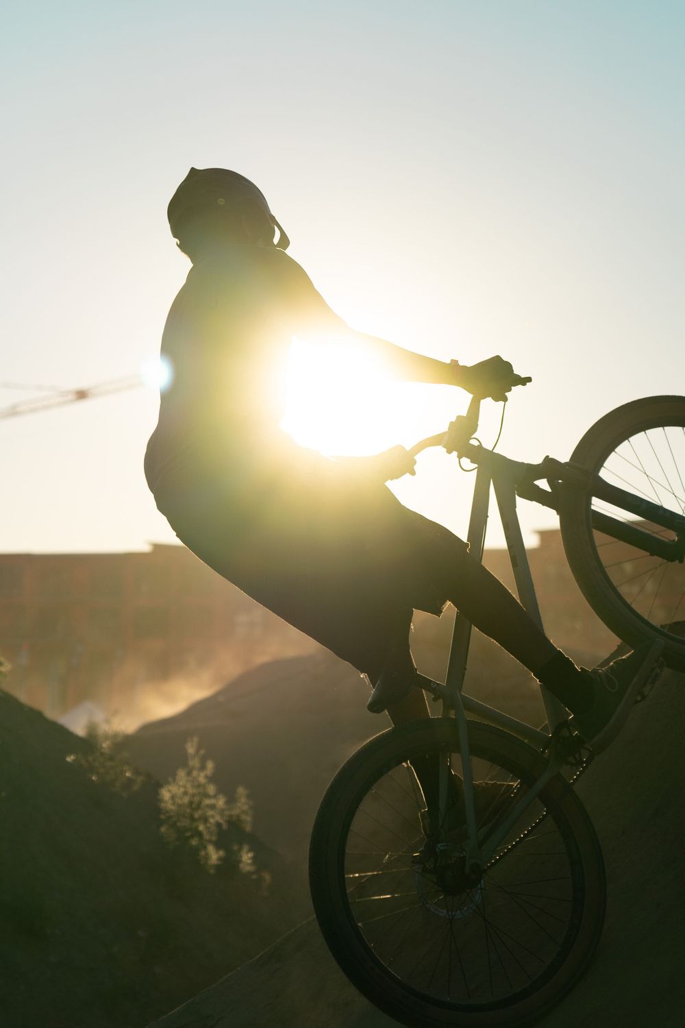 Silhouette of mountain biker sunset