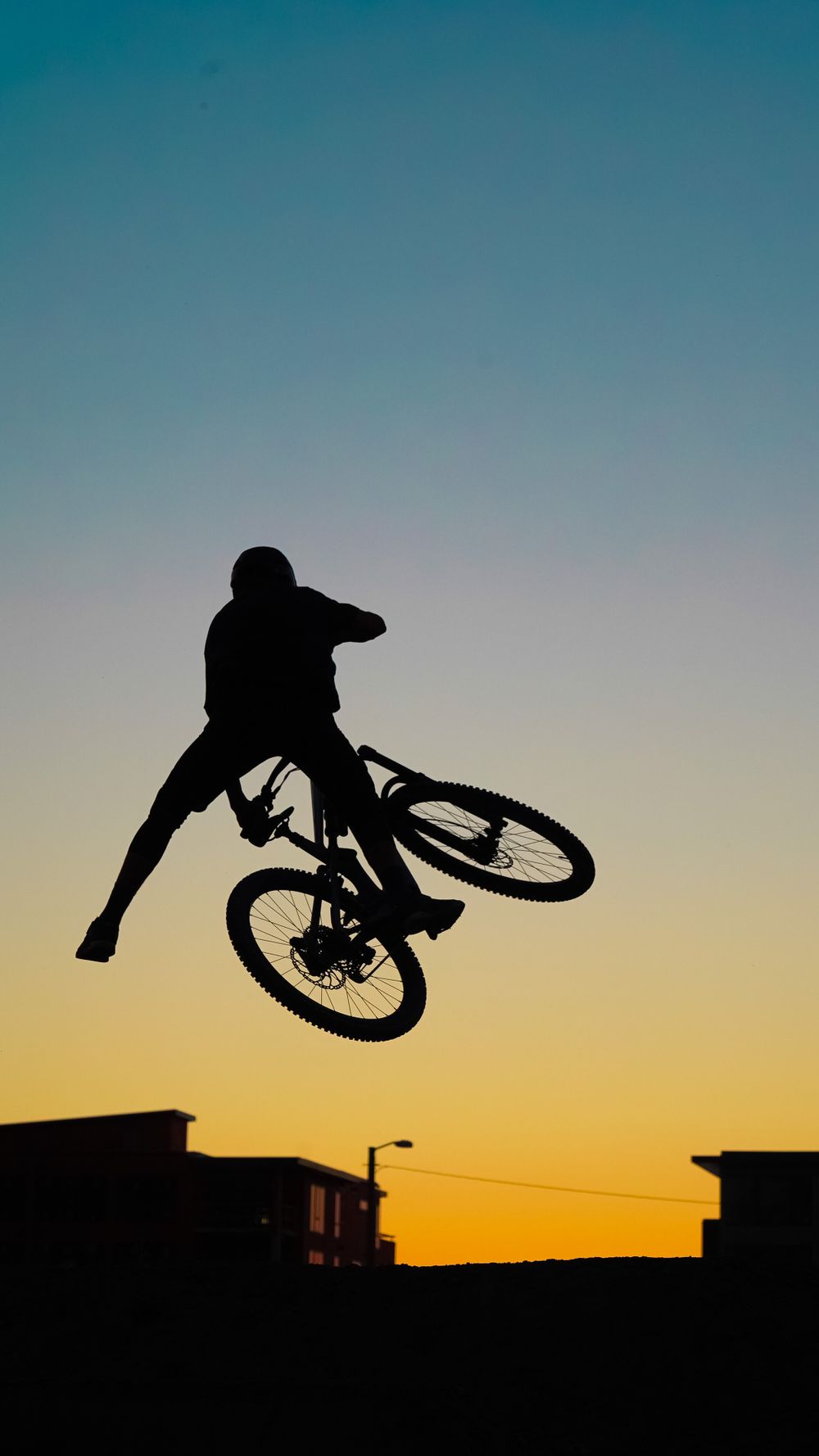 Sunset jumping mountain biker