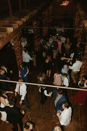 Overhead view of wedding reception dance floor with guests enjoying the celebration.