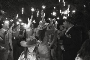 Wedding celebration at night with sparklers creating a magical atmosphere.