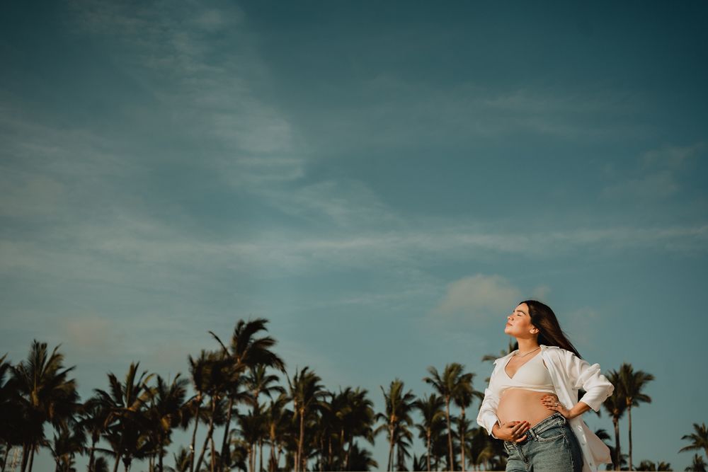 he pregnant wife gazing at the sky, a serene moment on the beach in Mazatlán