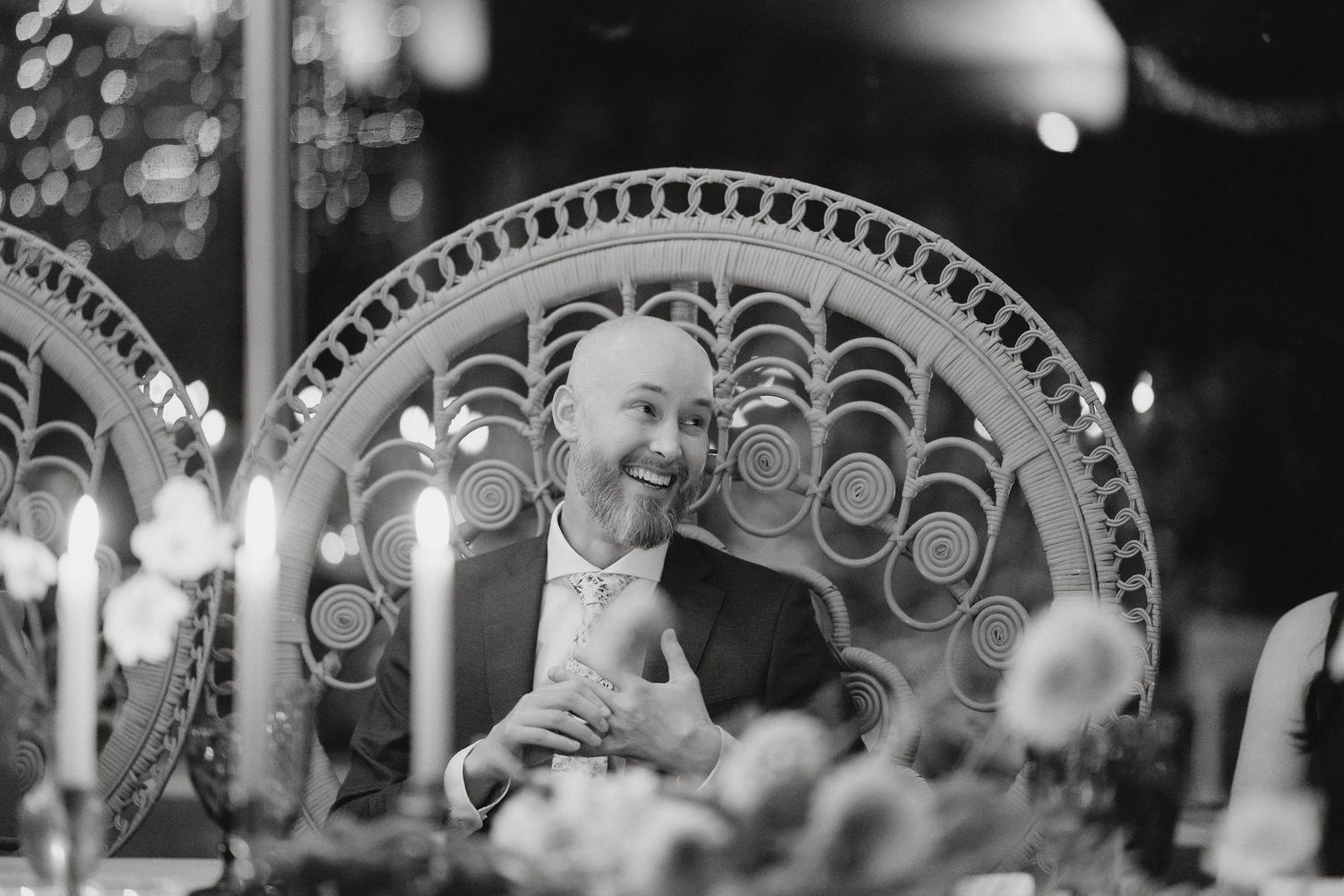 Black and white vintage photo of a mirrored reflection in an ornate circular frame with decorative pattern details.