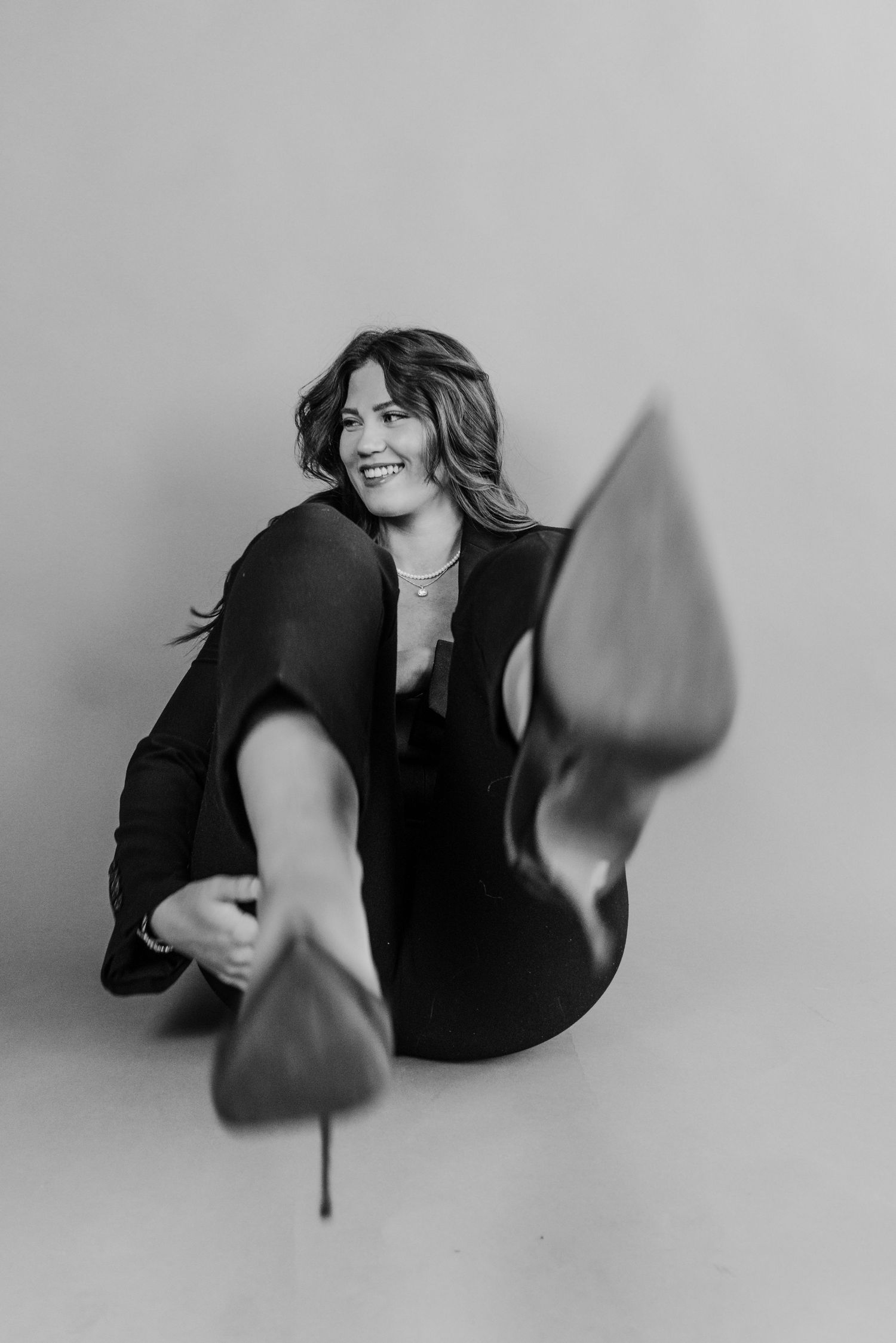 Dynamic black and white portrait series showing movement and expression.