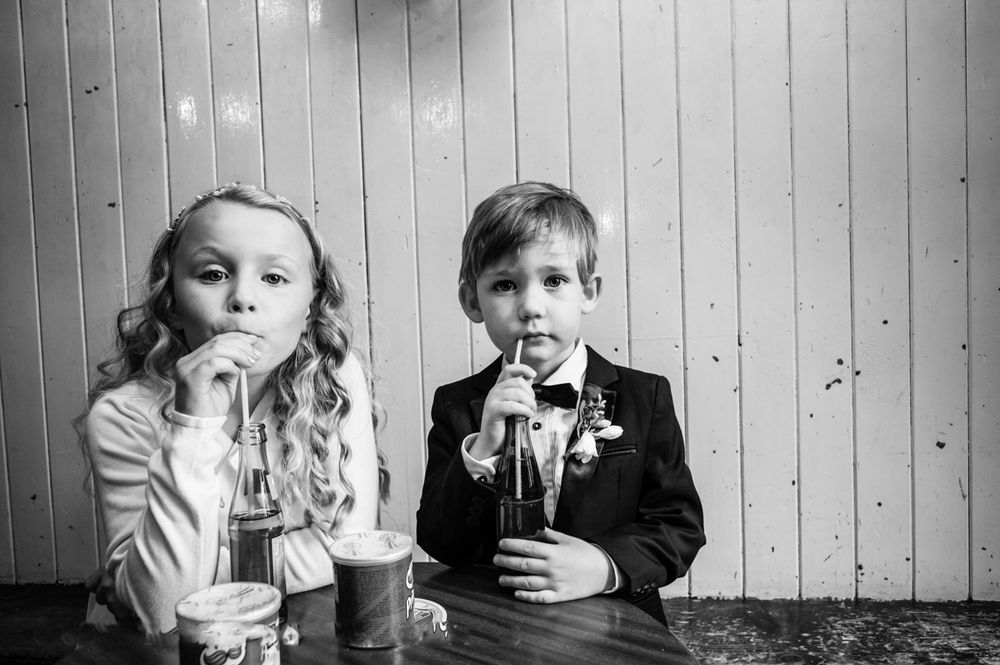 2 kids with drinks at a wedding in Barcelona