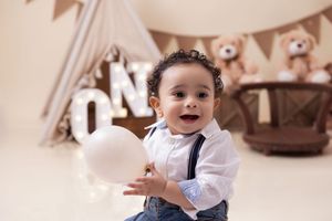 A series of candid moments captured at a celebration with decorative bunting banners and festive decor.